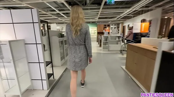 Kinky girl is stuffing anal plug in public toilet at IKEA and flashing pussy upskirt no panties publically