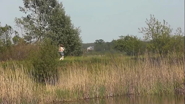 Wild beach. Naked in public. Two fisherman guys saw beautiful MILF on shore of lake, who sunbathes nude, masturbates wet pussy, gets strong orgasm. Masturbation in public. Outdoors. Outside. Nudist beach Naturists